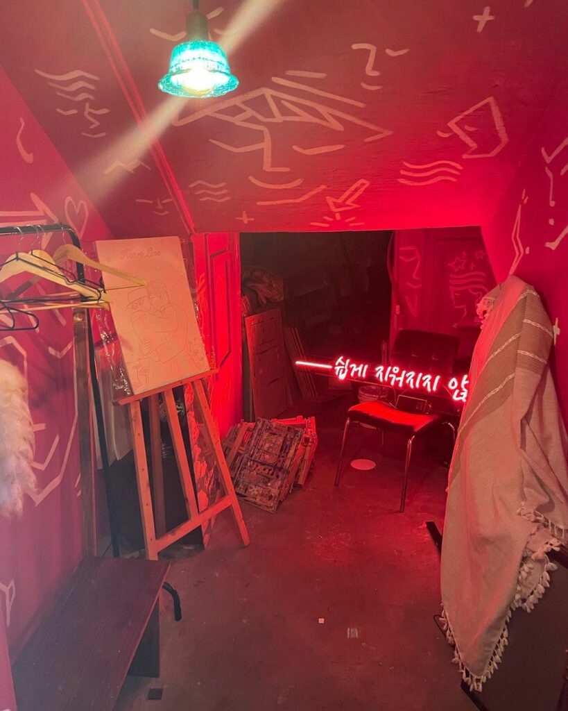Heartline Project - painting room with red lights 